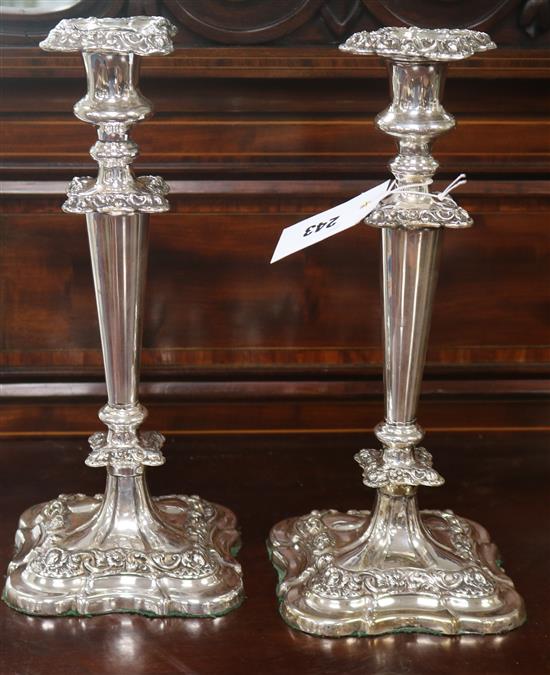 A pair of plated candlesticks